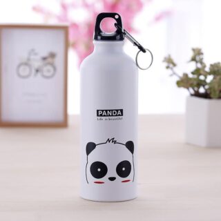 Portable 500 ml water bottle with panda animal print in white and black, on a table with a plant