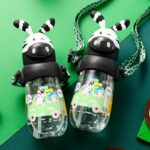 Children's water bottle 490 ml with black and white animal straw with green background