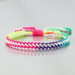 Rainbow braided bracelet for colored children on white background