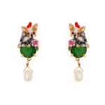 Girl's dog earring with white and green pearl on white background