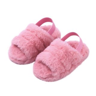 Girl's pink plush winter slipper on white background