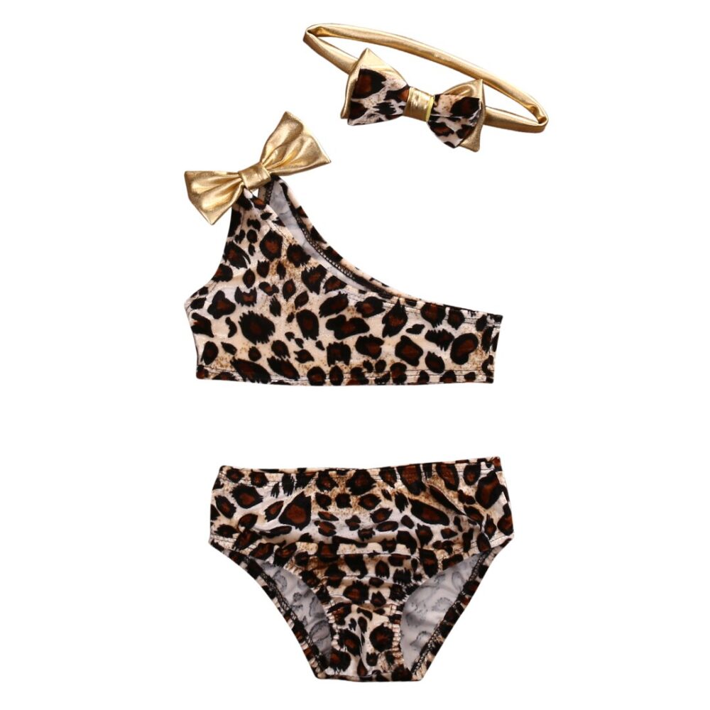 Girl's three-piece swimsuit with leopard print on white background