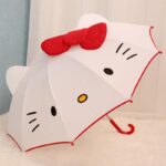 White and red Hello Kitty umbrella for children on a white and blue background