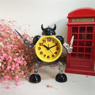 Metal robot alarm clock with red phone booth and pink flowers