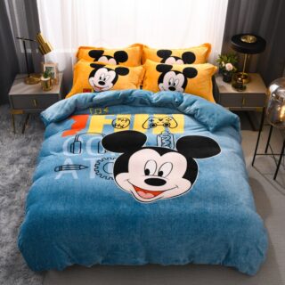 Comforter cover with Mickey print for a child in a bedroom in front of a window