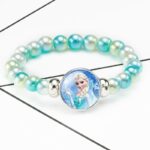 White and turquoise Snow Queen pearl bracelet on a white table