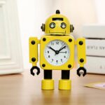 Yellow robot alarm clock on brown furniture with books
