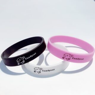 Solid color silicone bracelet with writing on white background