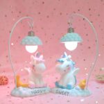 LED bedside lamp with 3D blue unicorn on pink background with gold stars