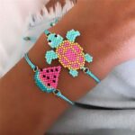 Turquoise watermelon and turtle boho bracelet for child on a woman's wrist