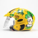 Motorcycle helmet with yellow and green cartoon visor on white background
