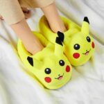 Plush Pikachu slipper for kids with a white blanket