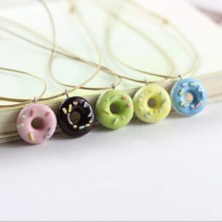 Children's necklace with donut pendant in pink, black, green, yellow and blue with thread