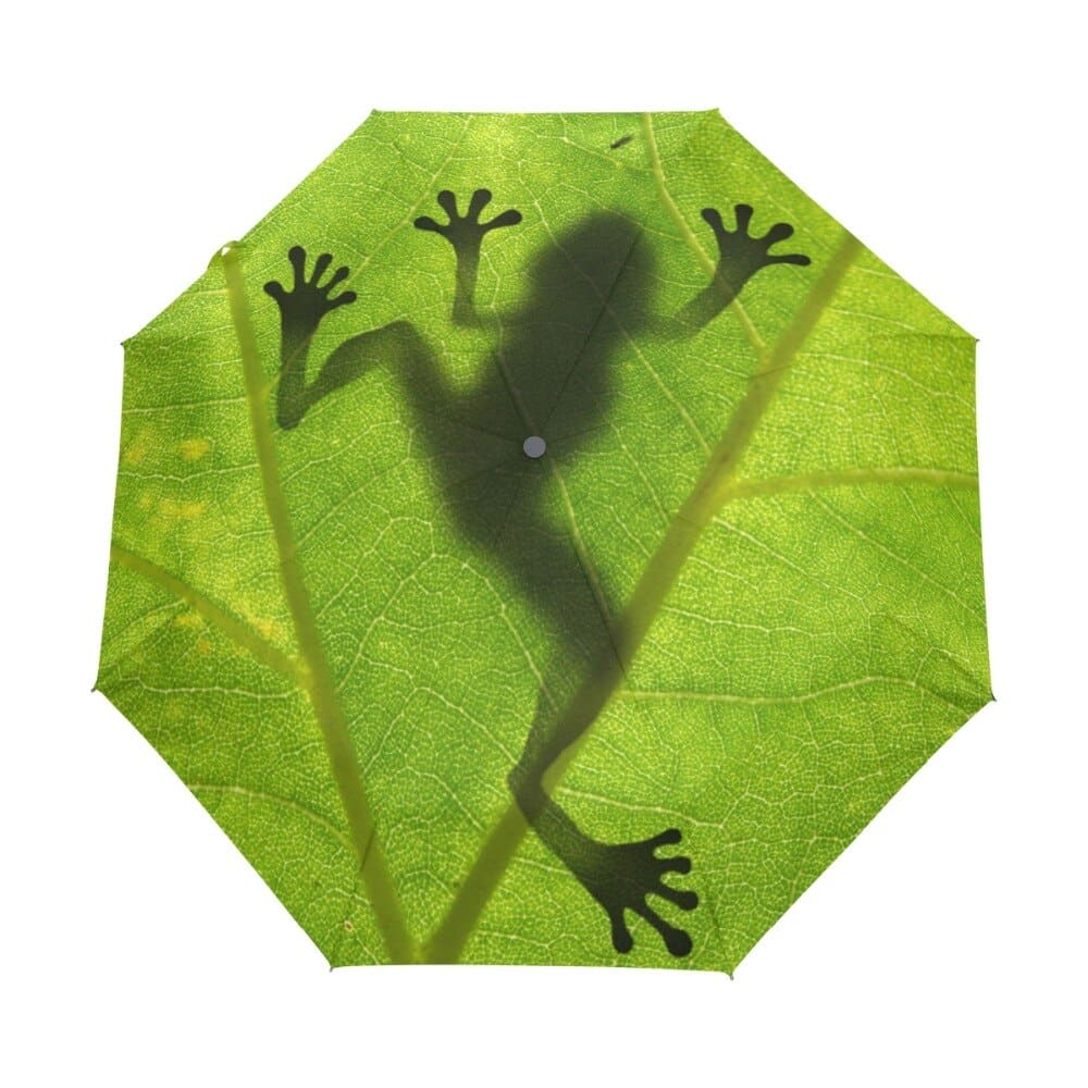 Children's umbrella with green leaf frog design on white background