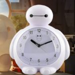 White robot alarm clock with black eyes and mouth
