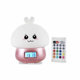 Pink and white silicone rabbit alarm clock with remote control on white background