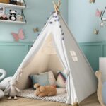 Children's indoor Indian tepee in a green room with stuffed animals
