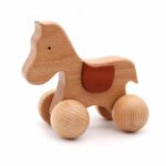 brown wooden rolling horse for children