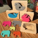 Colorful wooden educational puzzle toy for children on a wooden table
