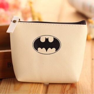 Coin purse with Batman logo in beige on a wooden base