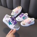 Glitter baby sneakers in white with blue star and purple and pink laces