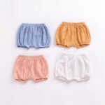 Pleated linen shorts for kids in orange, white, blue and pink