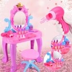 Little girl's pink and turquoise musical dressing table with accessories and horse dryer