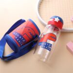 Red and blue children's water bottle with dinosaur motif and bag