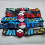 Several Pokémon Ball stretch belts for kids in different colors