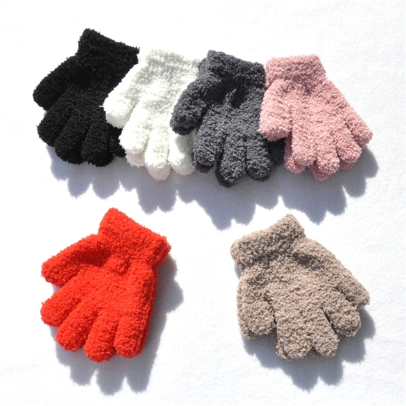 6 pairs of gloves laid flat in black, white, grey, beige, pink and red